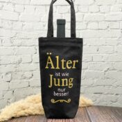 Flaschentasche schwarz mit Aufdruck in gold und weissem Spruch "Aelter ist wie Jung nur besser"